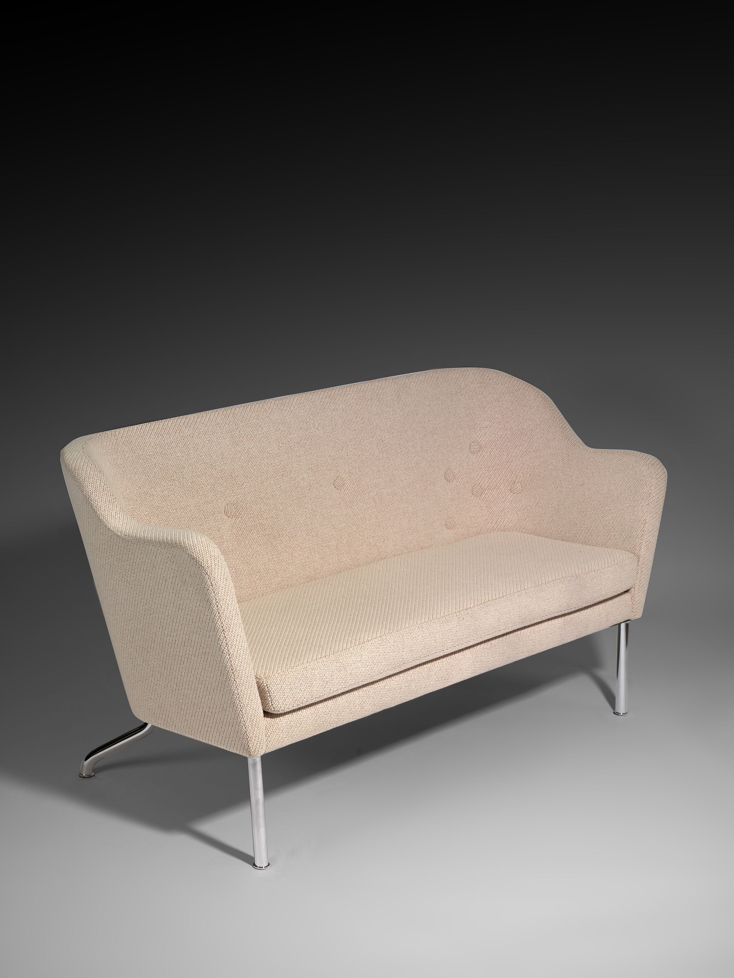 A Beatrix sofa in light fabric against a light gray background.