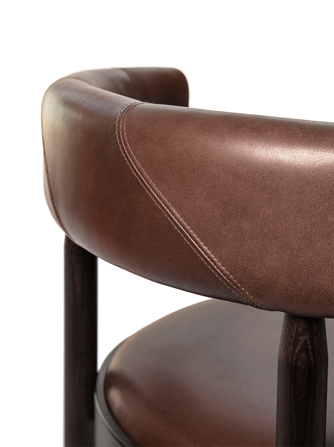 A close-up view of the Botero Barstool in brown leather with visible stitching.